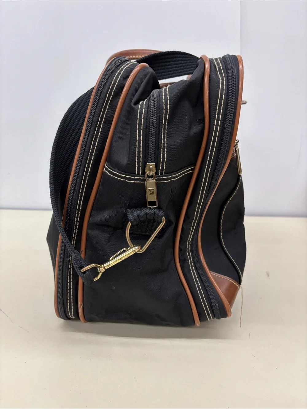Leisure Black Travel Duffel Bag with Brown Trim and Stripe Accent